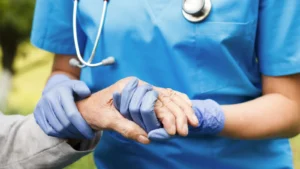 nurse carer holding hand
